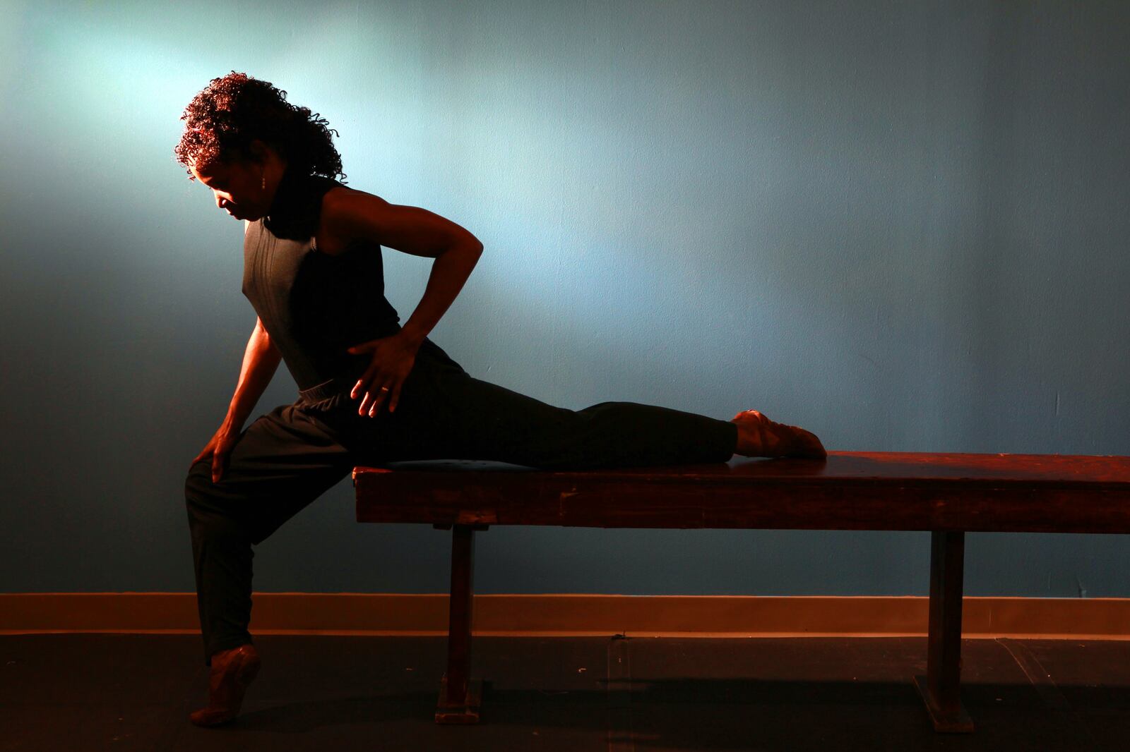 Sheri "Sparkle" Williams, the iconic long-time dancer for DCDC, sustained an injury that put her career in jeopardy. Filmmakers Steven Bognar and Julia Reichart are chronicling her recovery and her triumphal return at the company's concert earlier this month. At right, Williams stretches her hip.