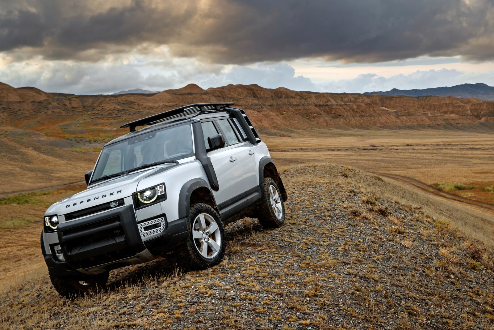 This photo provided by Jaguar Land Rover Ltd. shows the 2021 Land Rover Defender. The Defender combines luxury and off-road capability in the same sleek package, with lots of options for owners that want to go far off the beaten path. (Nick Dimbleby/Jaguar Land Rover Ltd. via AP)