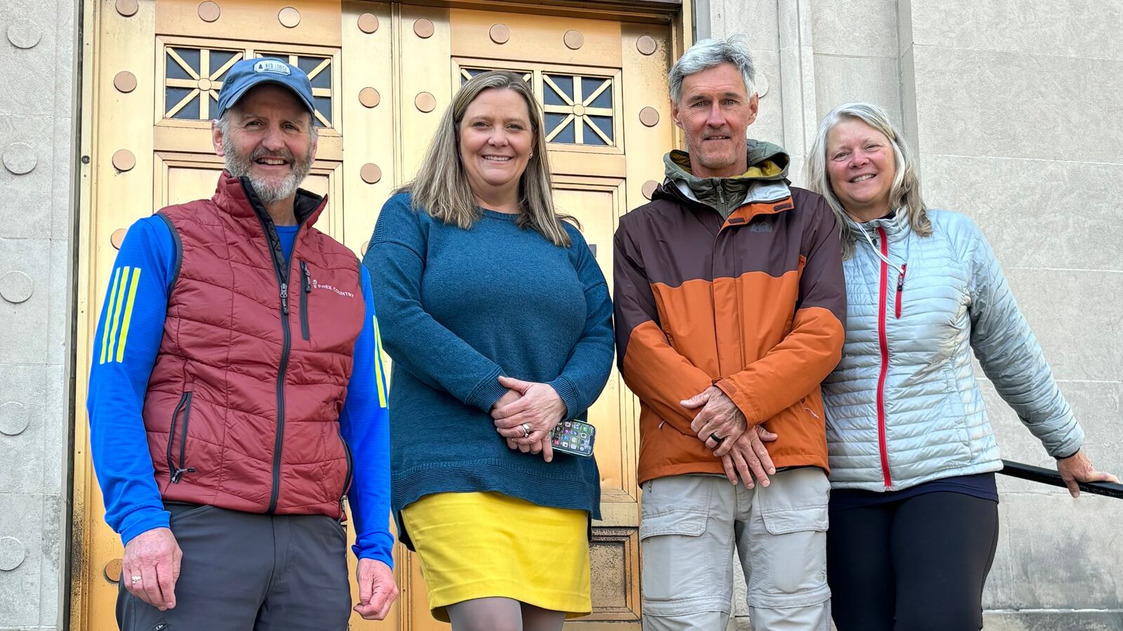 Pictured are Ron (center right) and Joy (right) McAdams with Great Miami Riverway Manager Dan Foley (left) and Miami Conservancy District General Manager MaryLynn Lodor outside the Conservancy District's offices in downtown Dayton. FILE 