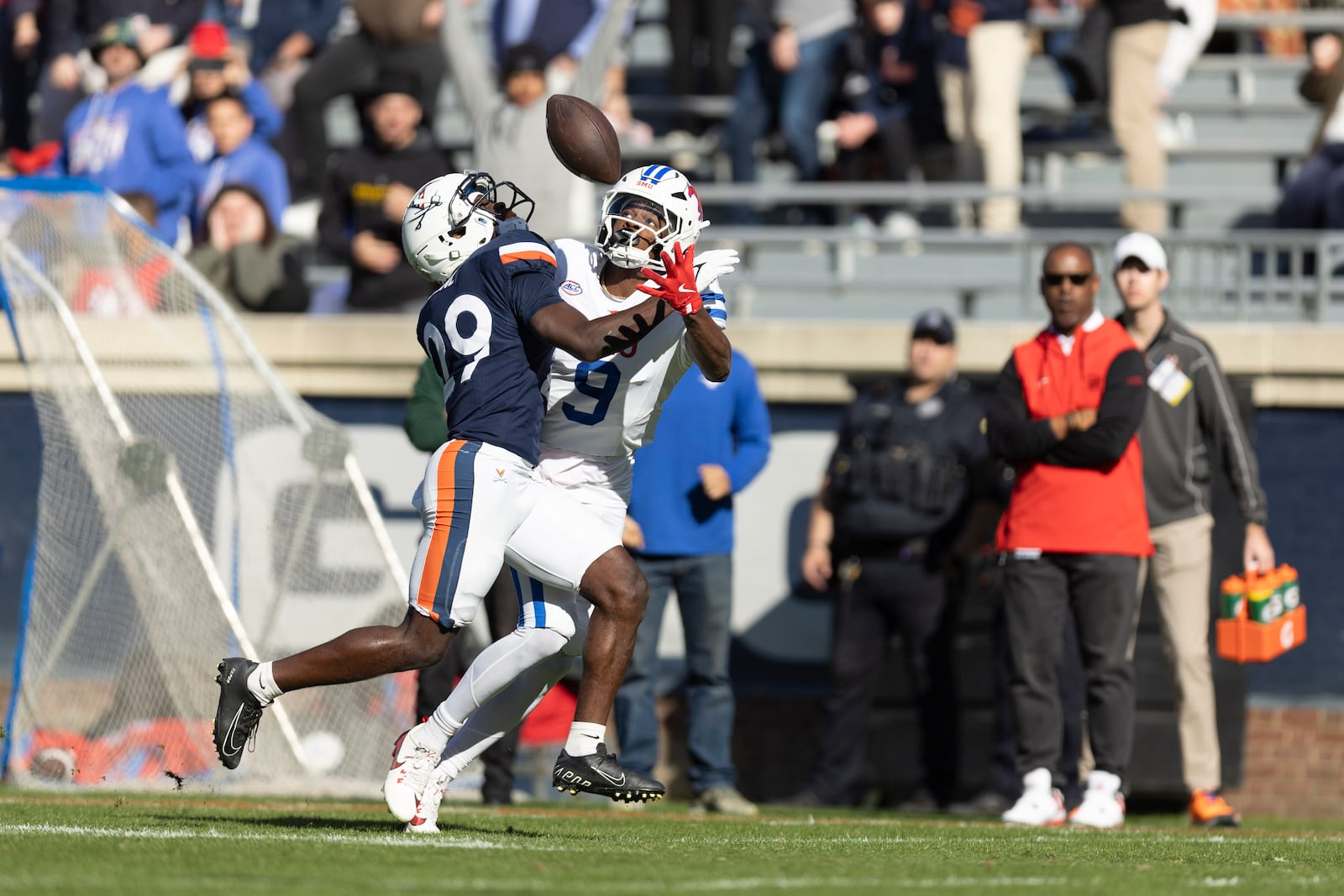 Virginia cornerback Kempton Shine (29) defends Southern Methodist wide receiver Key'Shawn Smith (9) during the first half of an NCAA college football game, Saturday, Nov. 23, 2024, in Charlottesville, Va. The pass was incomplete.(AP Photo/Mike Kropf)