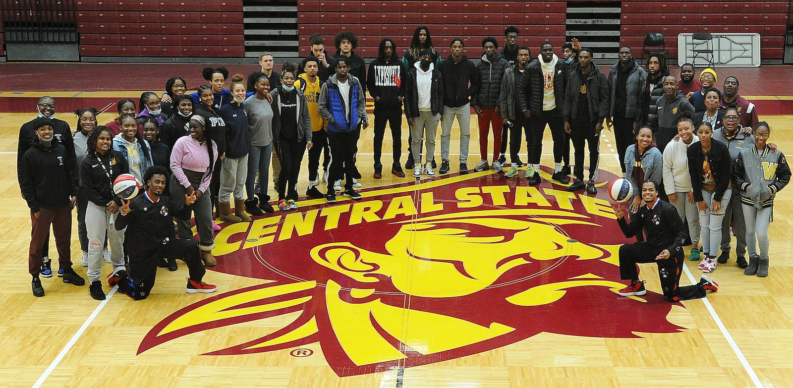 Too Tall Winston, bottom left and Wham Middleton, bottom right, of the world-famous Harlem Globetrotters made an appearance at Central State University on Monday, Nov. 15, 2021 to talk about anti-bullying efforts and encourage students to complete their education. MARSHALL GORBY\STAFF