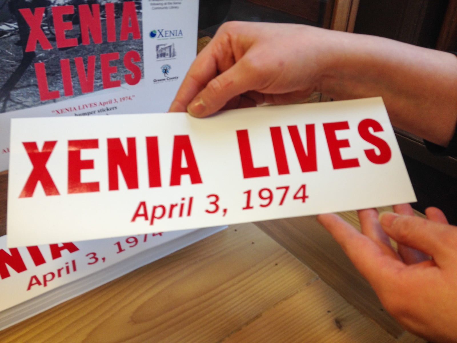 After the 1974 tornado, the Aldine Printing Company produced the Xenia Lives bumper stickers. Recently, The Greene County Library and the City of Xenia had the bumper stickers reprinted to help raise money for survivors of the Moore, Okla. tornado in 2013.