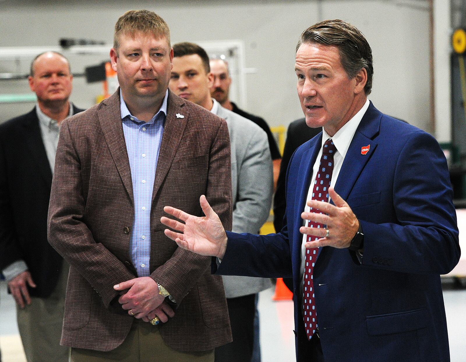 J. Micah North, President & CEO Resonant Sciences, left, listens to Ohio Lt. Gov. Jon Husted talk to his employees Tuesday May 2, 2023 about in-demand jobs. The company is located at 4085 Executive Drive, Beavercreek. MARSHALL GORBY\STAFF