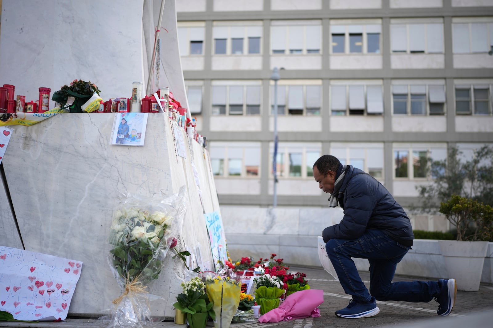 A man prays at the Agostino Gemelli Polyclinic, in Rome, Friday, Feb. 28, 2025 where Pope Francis is hospitalized since Friday, Feb. 14.(AP Photo/Alessandra Tarantino)