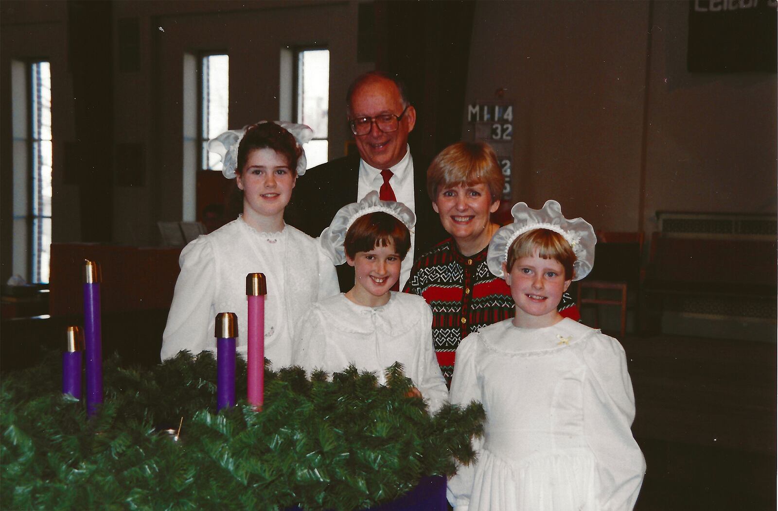 Foster children Beth, Lois and Crystal (left to right front) with Jim and Peggy Hanna in 1993. The couple would eventually legally adopt Lois and Crystal. Though all are grown, Beth calls Peggy "Mom." CONTRIBUTED