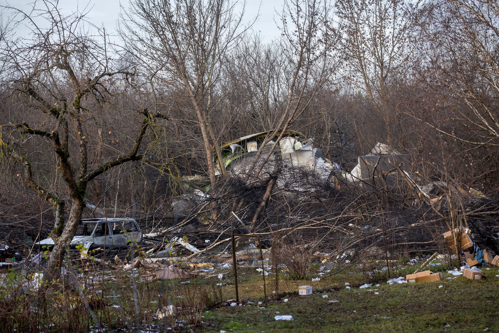 A view of the wreckage of the DHL cargo plane that crashed into a house near Vilnius, Lithuania, Monday, Nov. 25, 2024. (AP Photo/Mindaugas Kulbis)