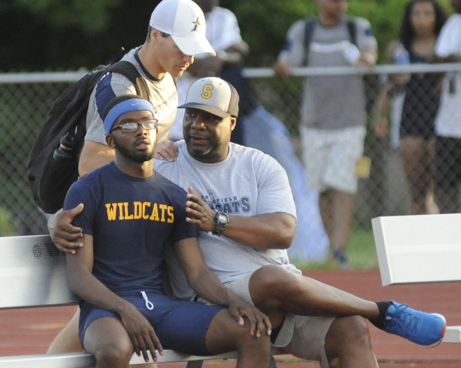 Springfield senior Austin Tyree (left) is consoled by coach Mike Davis after a 300 hurdles DQ during the D-I regional track and field meet at Wayne High School on Friday, May 24, 2019. MARC PENDLETON / STAFF