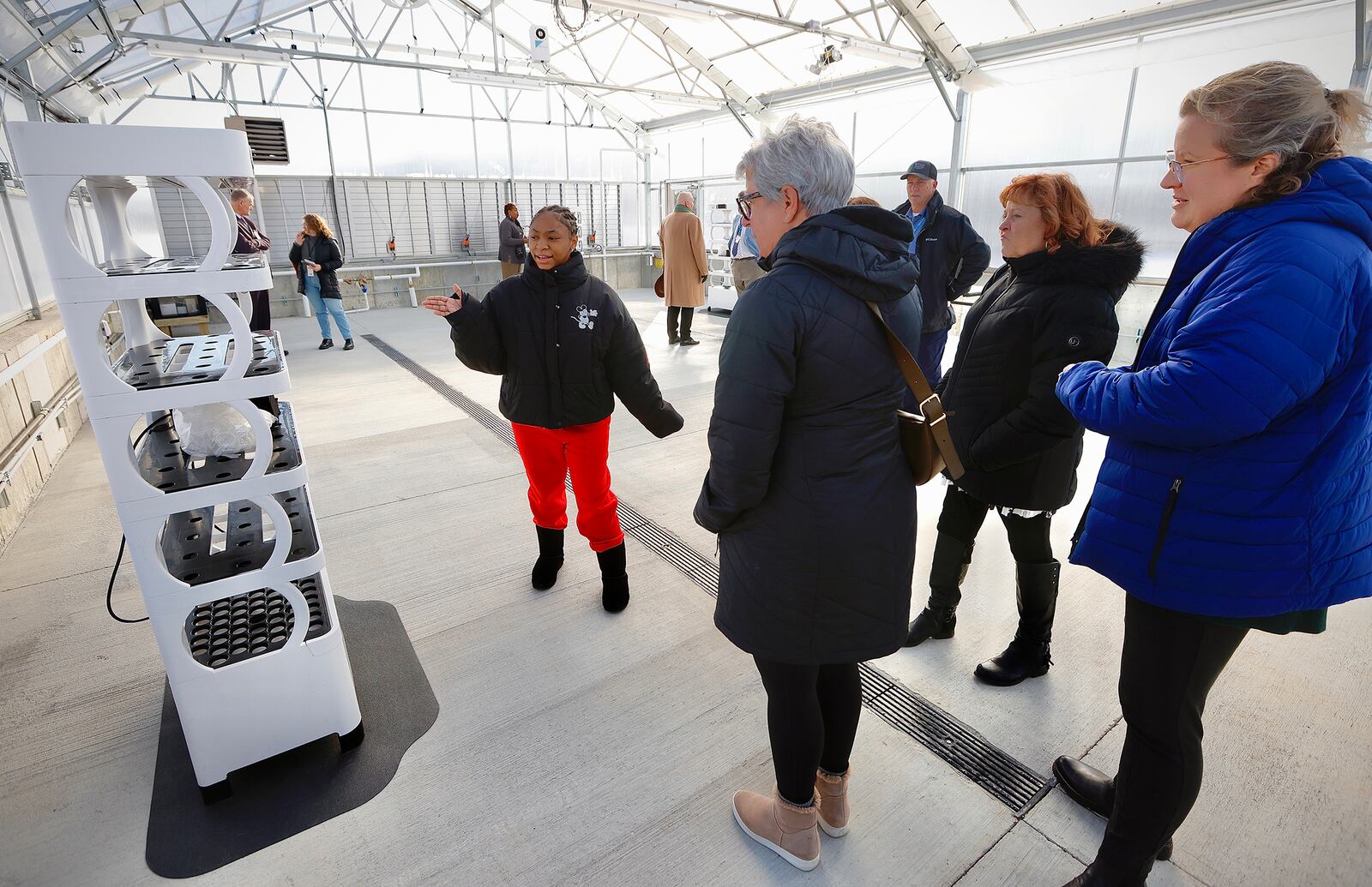 Jefferson Twp. schools officially opened their new agriculture program/center Monday, Jan. 13, 2025. Jefferson Twp. High School, ninth grader, Jalahn Crump, talks with guests about the new greenhouse at the school. MARSHALL GORBY\STAFF