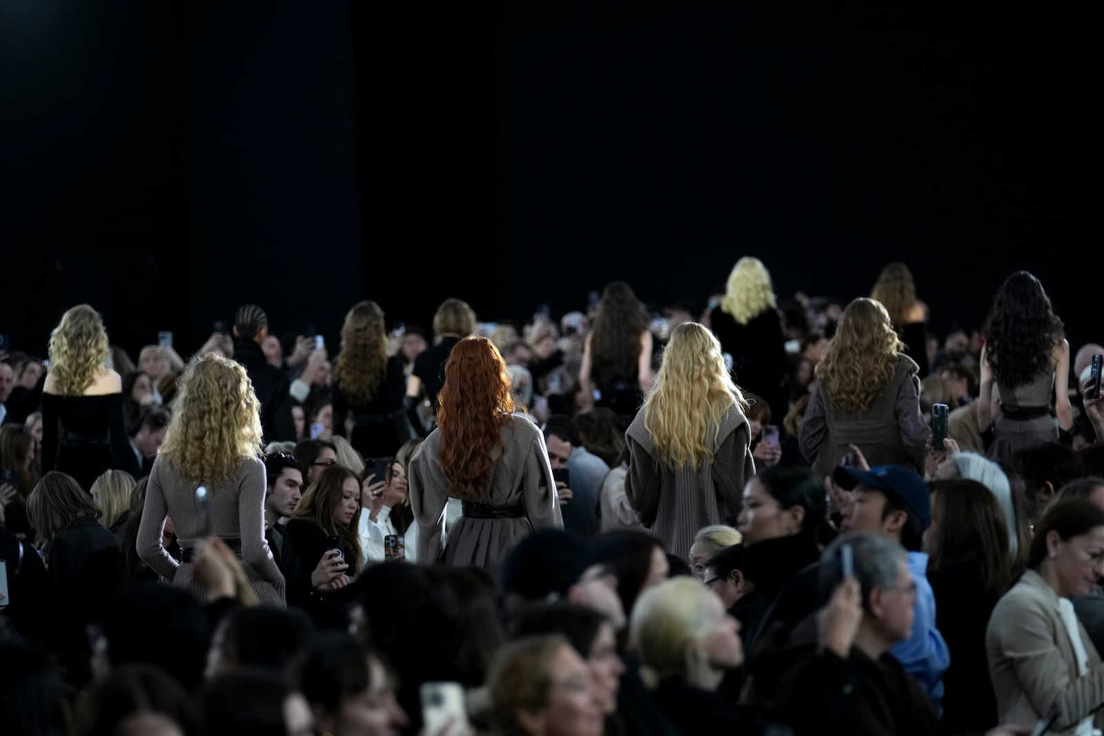 Models wear creations as part of the Max Mara Fall/Winter 2025-2026 Womenswear collection presented in Milan, Italy, Thursday, Feb. 27, 2025. (AP Photo/Antonio Calanni)