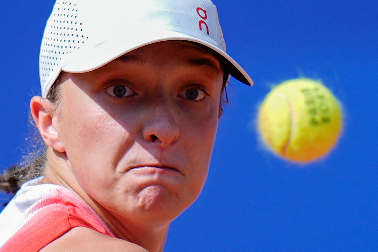 FILE - Iga Swiatek of Poland eyes on the ball as she plays against Anna Karolina Schmiedlova of Slovakia during their women's bronze medal match, at the 2024 Summer Olympics, Friday, Aug. 2, 2024, at the Roland Garros stadium in Paris, France. (AP Photo/Andy Wong, File)