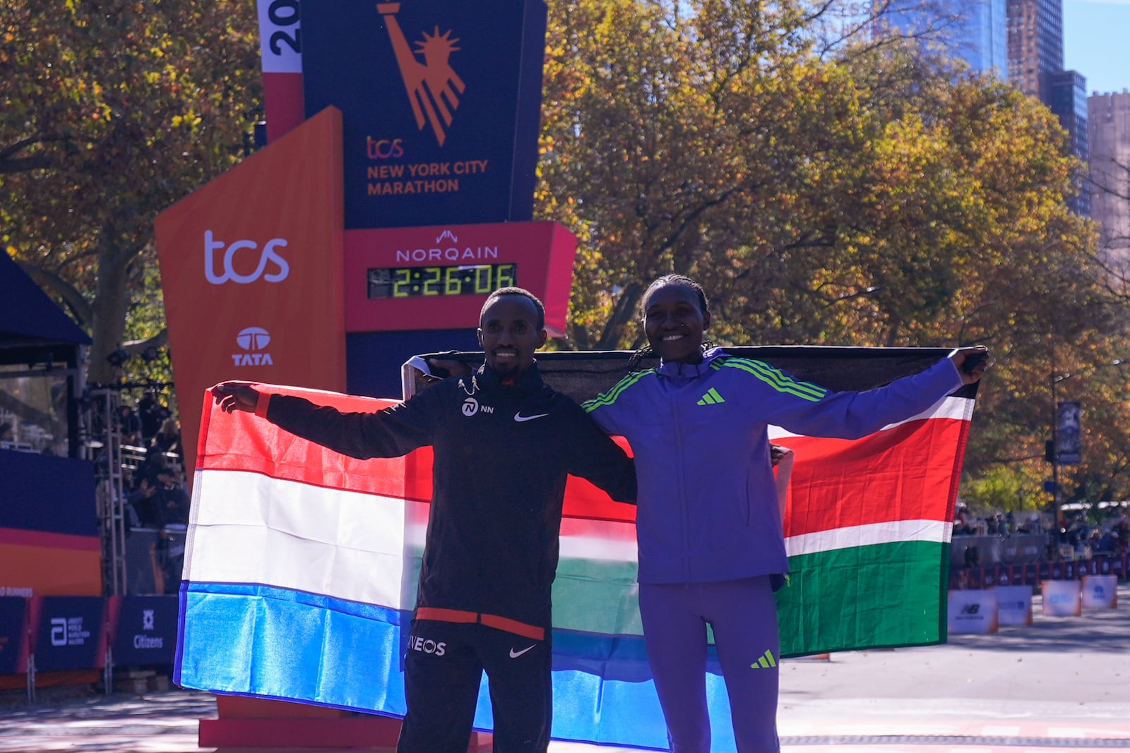 Women's division winner Sheila Chepkirui, right, poses with men's divsion winner Abdi Nageeye, of the Netherlands, during the New York City Marathon, Sunday, Nov. 3, 2024, in New York. (AP Photo/Frank Franklin II)