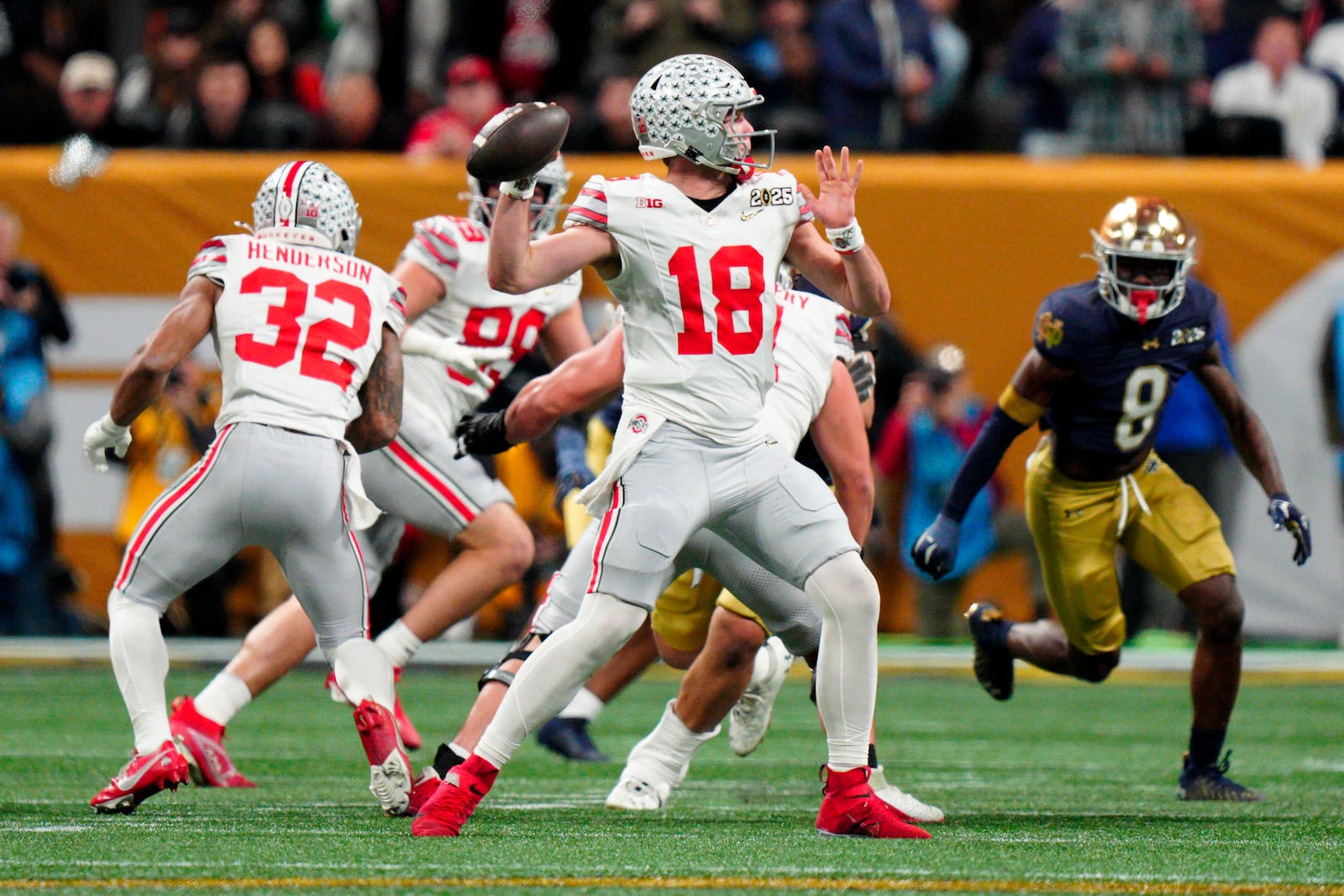 Ohio State quarterback Will Howard passes against Notre Dame during first half of the College Football Playoff national championship game Monday, Jan. 20, 2025, in Atlanta. (AP Photo/Jacob Kupferman)