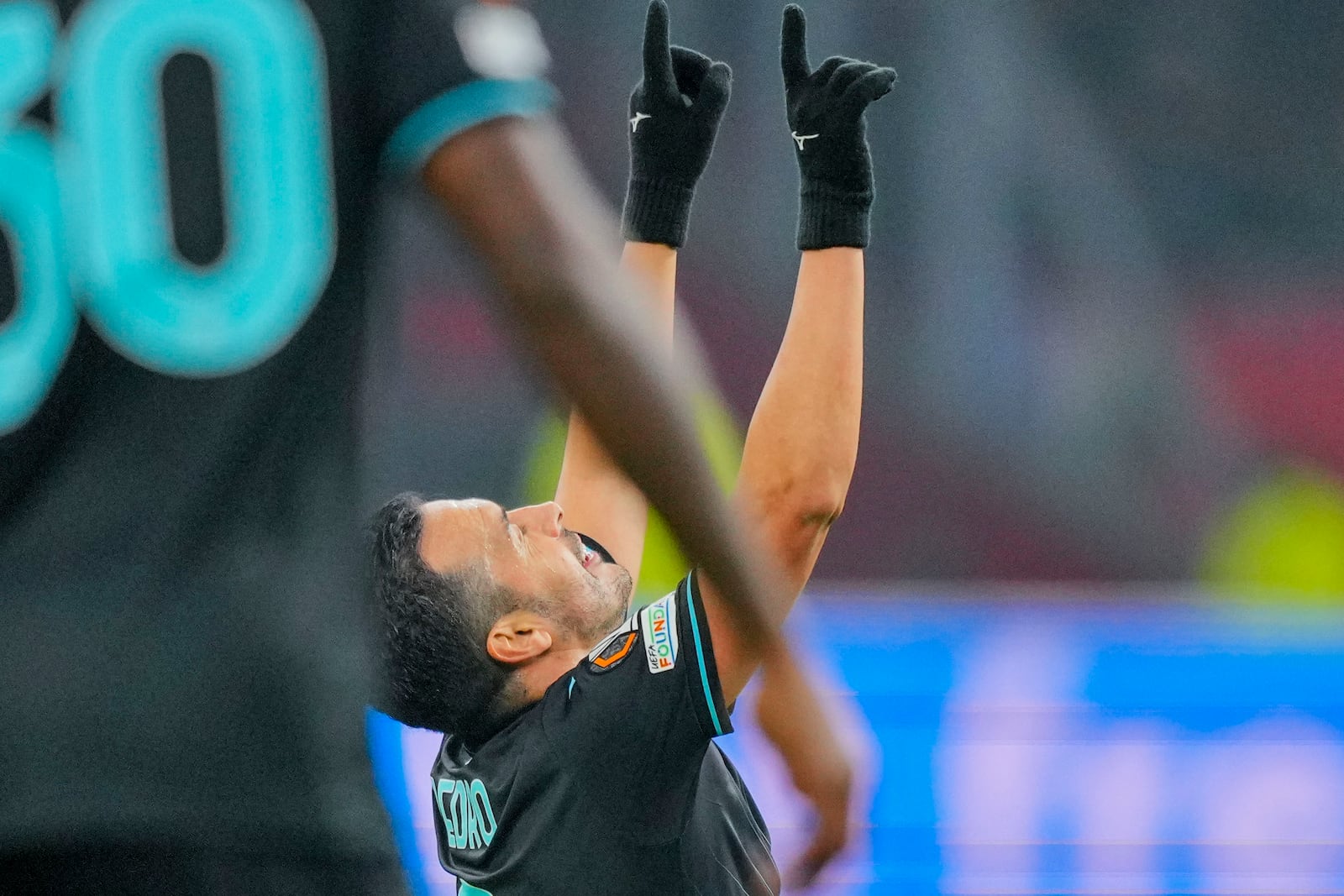 Lazio's Pedro celebrates after scoring during the Europa League soccer match between Ajax and Lazio Roma at the Johan Cruyff Arena in Amsterdam, Netherlands, Thursday, Dec. 12, 2024. (AP Photo/Peter Dejong)