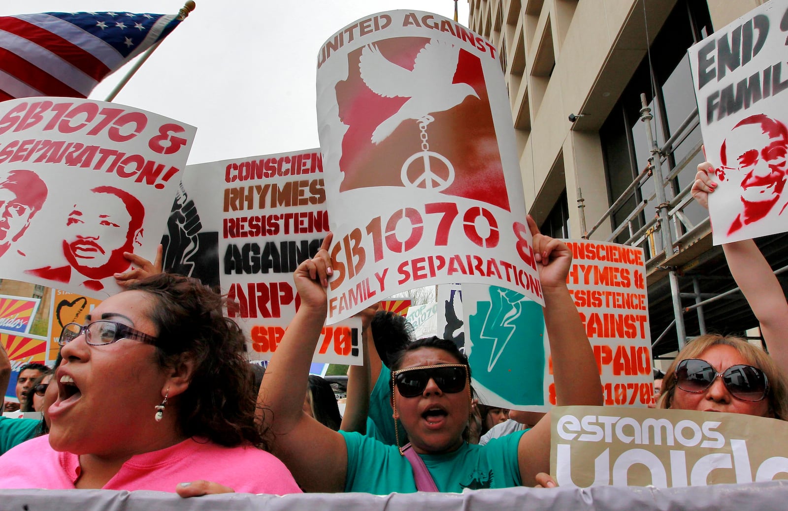 FILE - Protesters march against Arizona's illegal immigration law, SB1070, April 25, 2012, in Phoenix. (AP Photo/Matt York, File)