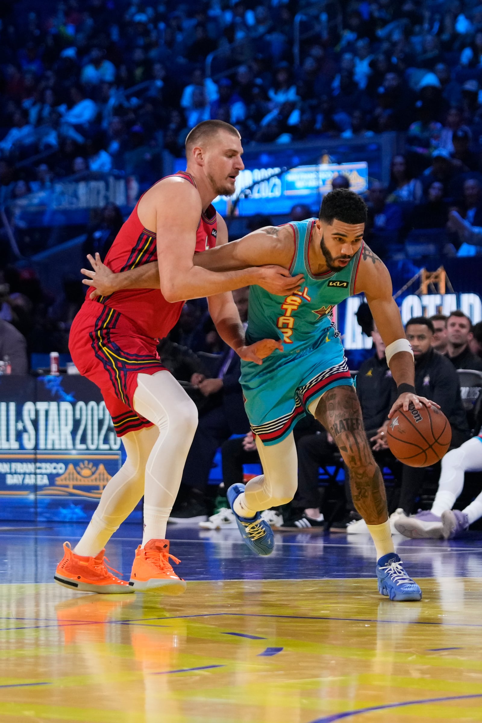 Boston Celtics guard Jayson Tatum dribbles past Denver Nuggets center Nikola Jokic during the NBA All-Star basketball game Sunday, Feb. 16, 2025, in San Francisco. (AP Photo/Godofredo A. Vásquez)