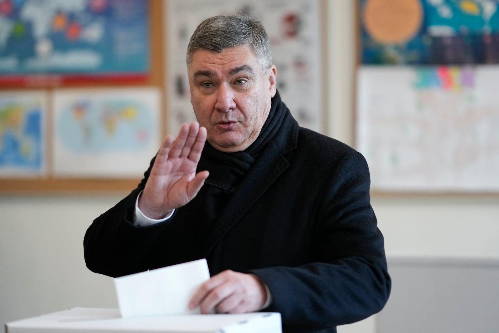 Croatia's President Zoran Milanovic casts his ballot during presidential elections, at a polling station in Zagreb, Croatia, Sunday, Dec. 29, 2024. (AP Photo/Darko Bandic)