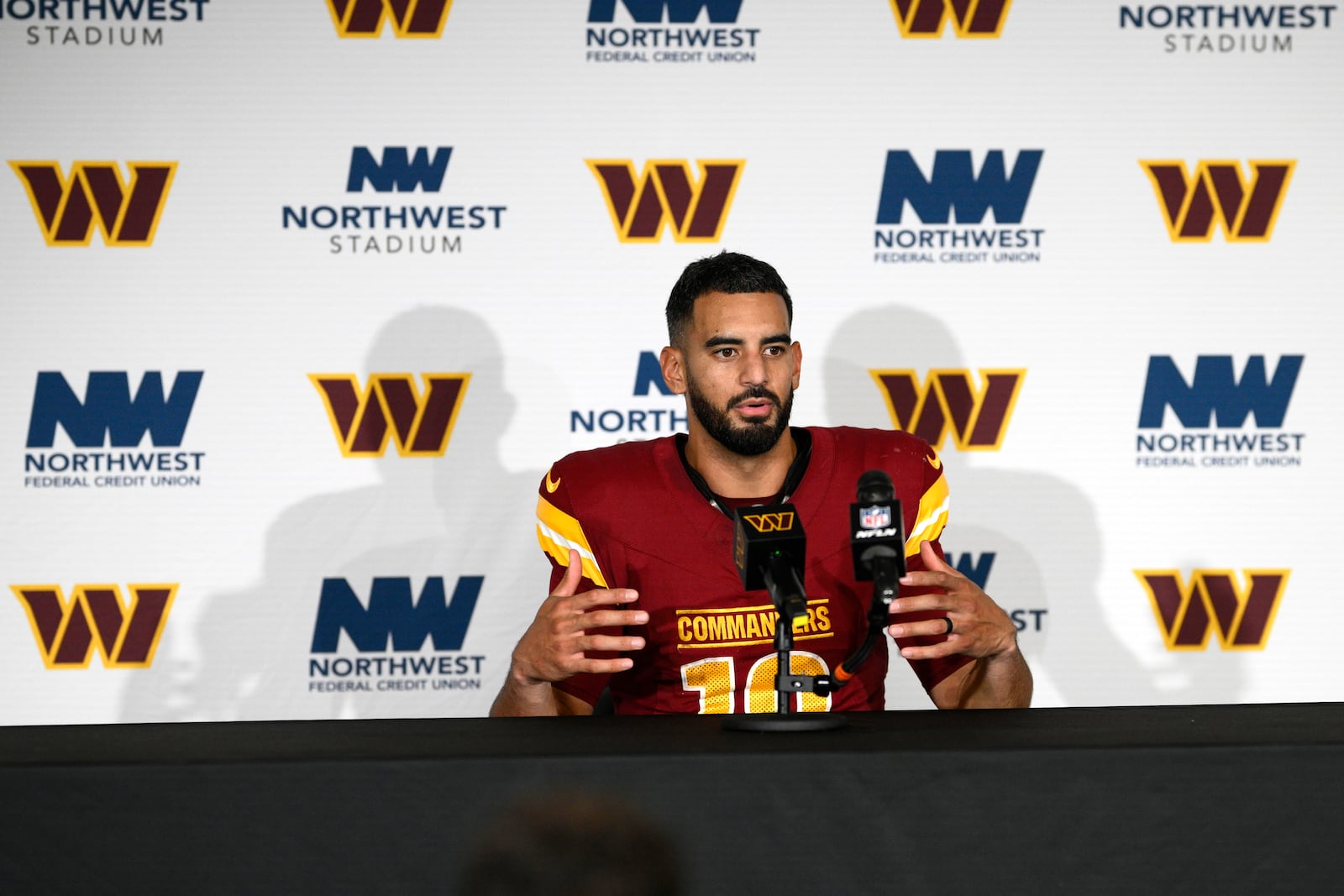 Washington Commanders quarterback Marcus Mariota speaks during a news conference after an NFL football game against the Carolina Panthers, Sunday, Oct. 20, 2024, in Landover, Md. The Commanders 40-7. (AP Photo/Nick Wass)