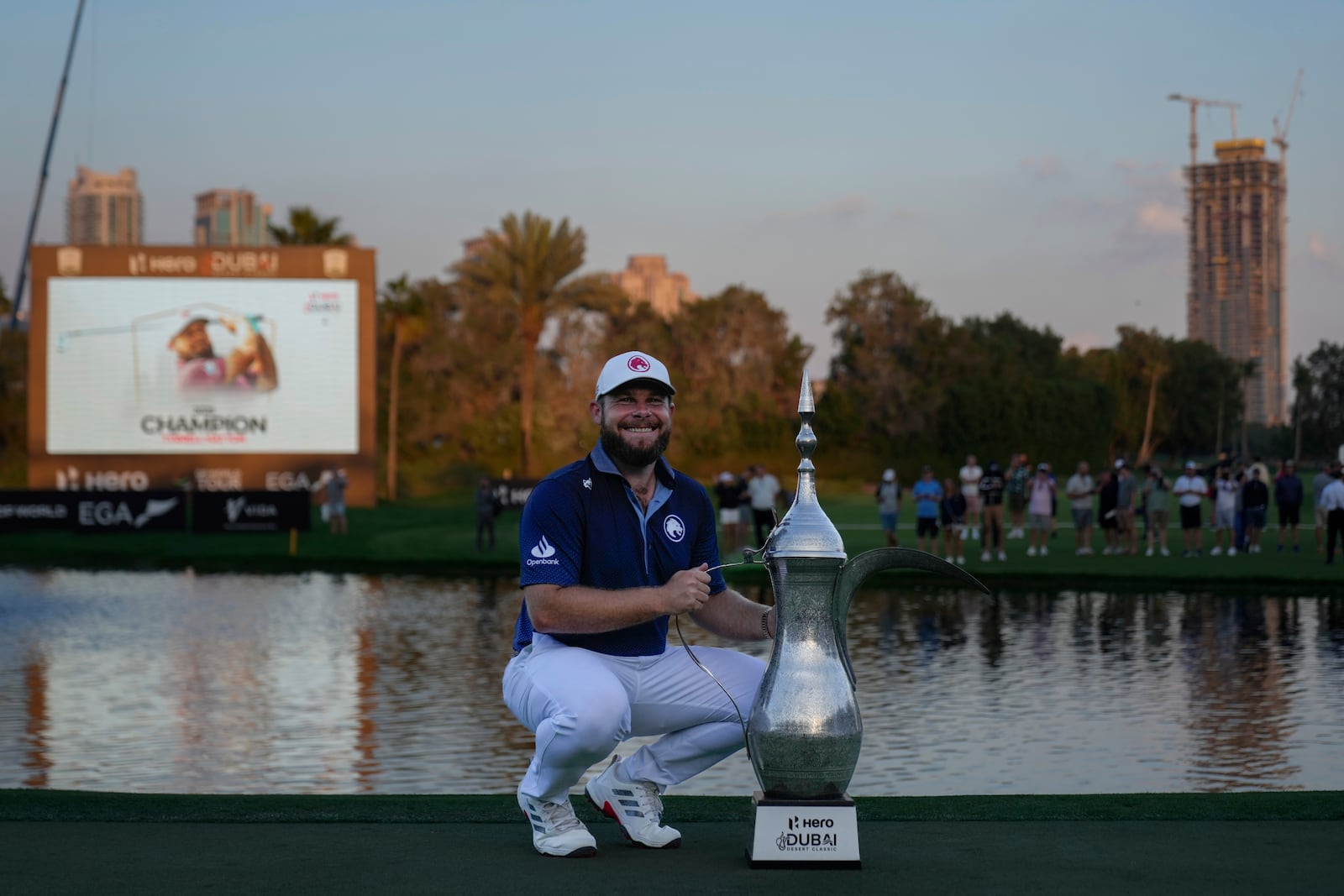 Tyrell Hatton of England poses with the trophy after winning the Dubai Desert Classic golf tournament, in Dubai, United Arab Emirates, Sunday, Jan. 19, 2025. (AP Photo/Altaf Qadri)