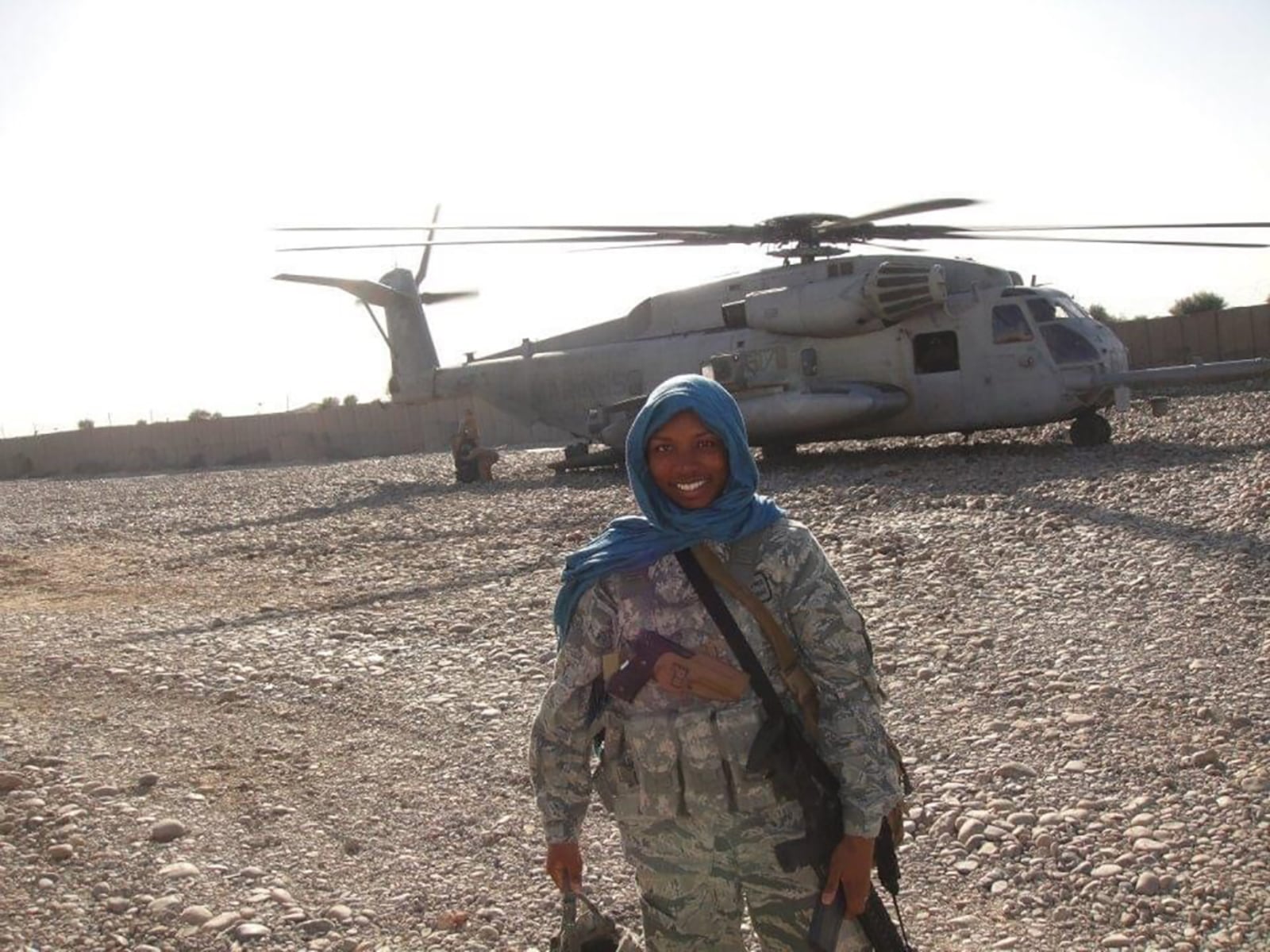 Tech Sgt. Sharma Haynes stands in front of an MH-53 Pave Low helicopter Oct. 18, 2011, during her deployment to New Kabul Compound, Afghanistan. CONTRIBUTED PHOTO