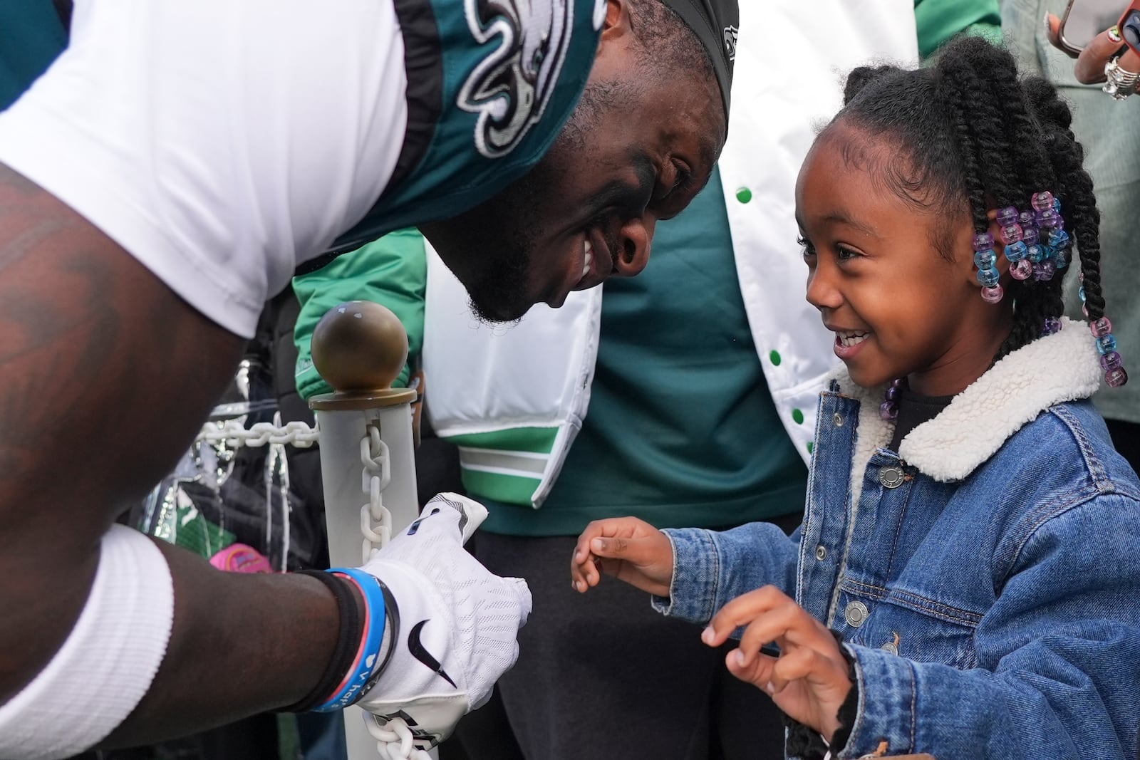 Philadelphia Eagles wide receiver A.J. Brown talks to his daughter Jersee before an NFL football game against the Carolina Panthers on Sunday, Dec. 8, 2024, in Philadelphia. (AP Photo/Chris Szagola)