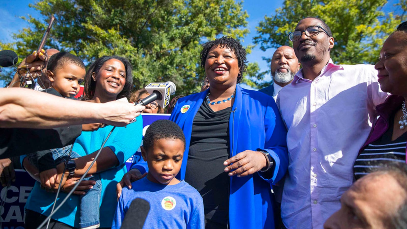 Surrounded by family and supporters, Georgia gubernatorial candidate Stacey Abrams speaks with the press after casting her early ballot at The Gallery at South DeKalb Mall in Decatur, Monday, October 22, 2018. Today marks only 15 days left until Election Day on Tuesday, November 6.  (Alyssa Pointer/Atlanta Journal-Constitution via AP)