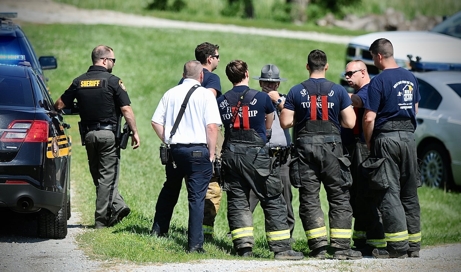 Emergency personnel on standby on East Possum Road after a helicopter crashed in a cornfield near I-70. MARSHALL GORBY/STAFF