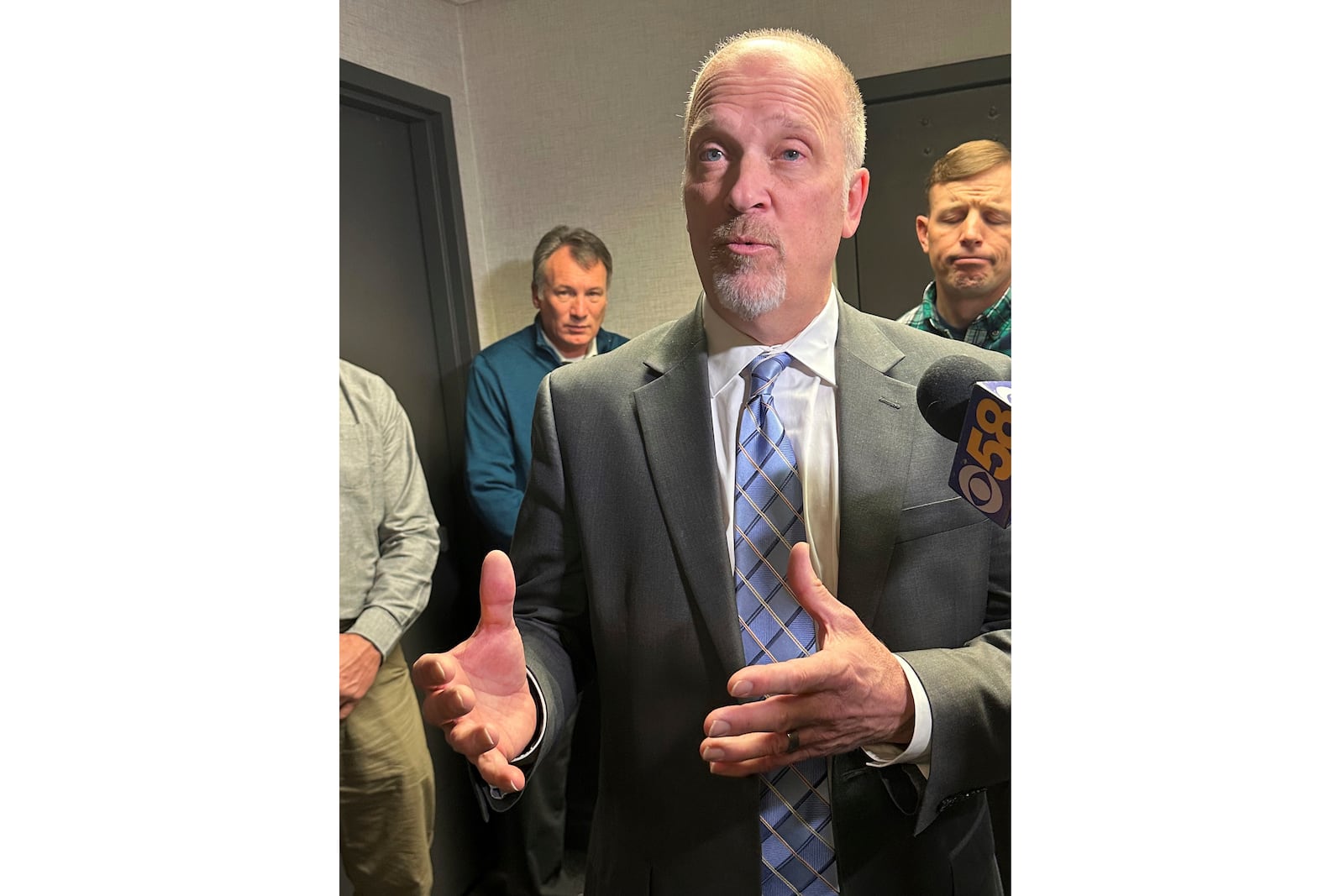 Wisconsin Supreme Court candidate Brad Schimel takes questions while surrounded by supporters on Wednesday, Feb. 26, 2025, in Madison, Wis. (AP Photo/Scott Bauer)