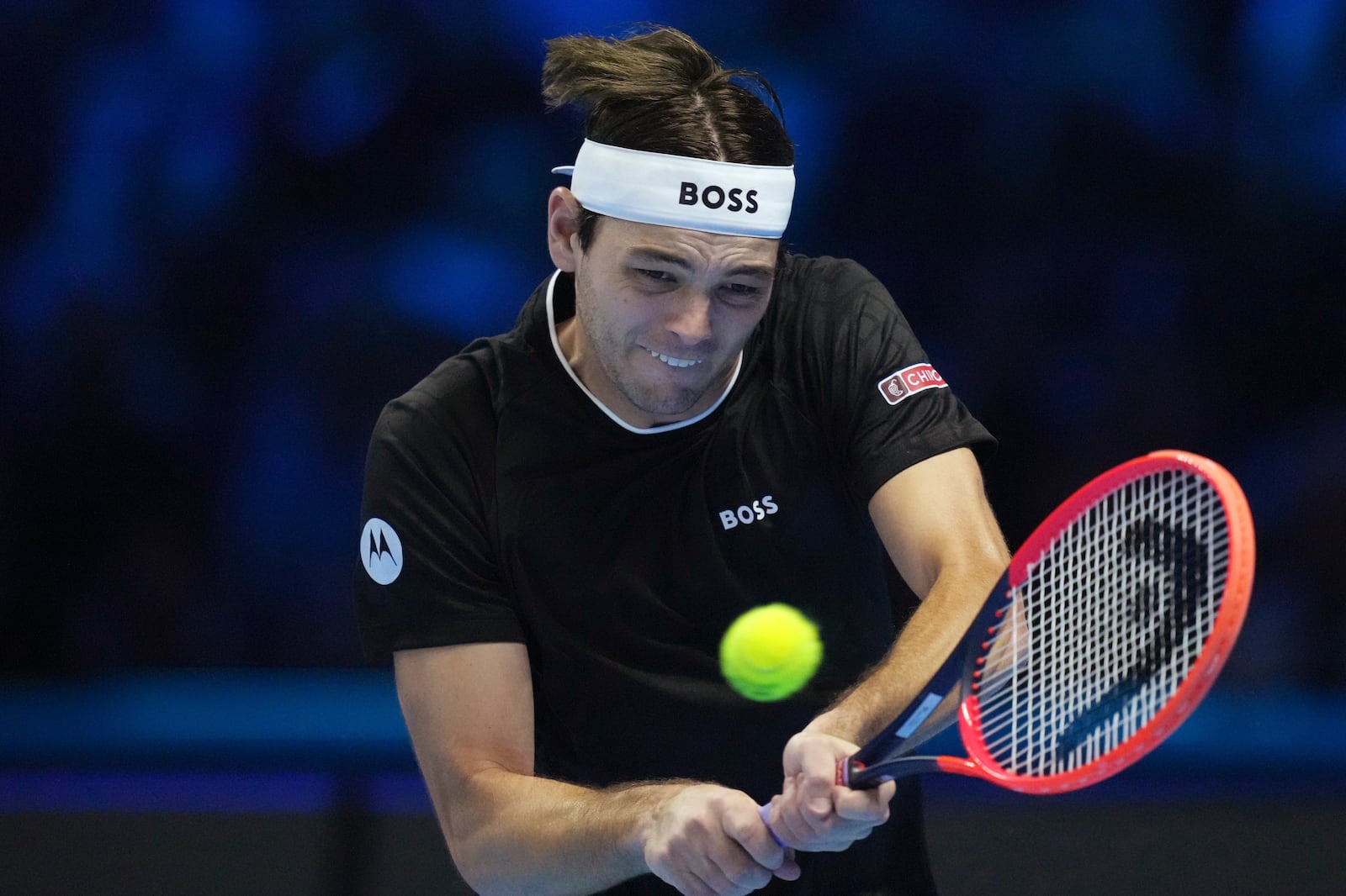 United States' Taylor Fritz returns the ball to Russia's Daniil Medvedev during their singles tennis match of the ATP World Tour Finals at the Inalpi Arena, in Turin, Italy, Sunday, Nov. 10, 2024. (AP Photo/Antonio Calanni)