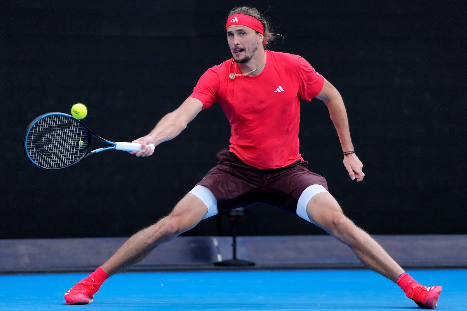 Alexander Zverev of Germany returns a shot from Ugo Humbert of France during their fourth round match at the Australian Open tennis championship in Melbourne, Australia, Sunday, Jan. 19, 2025. (AP Photo/Vincent Thian)