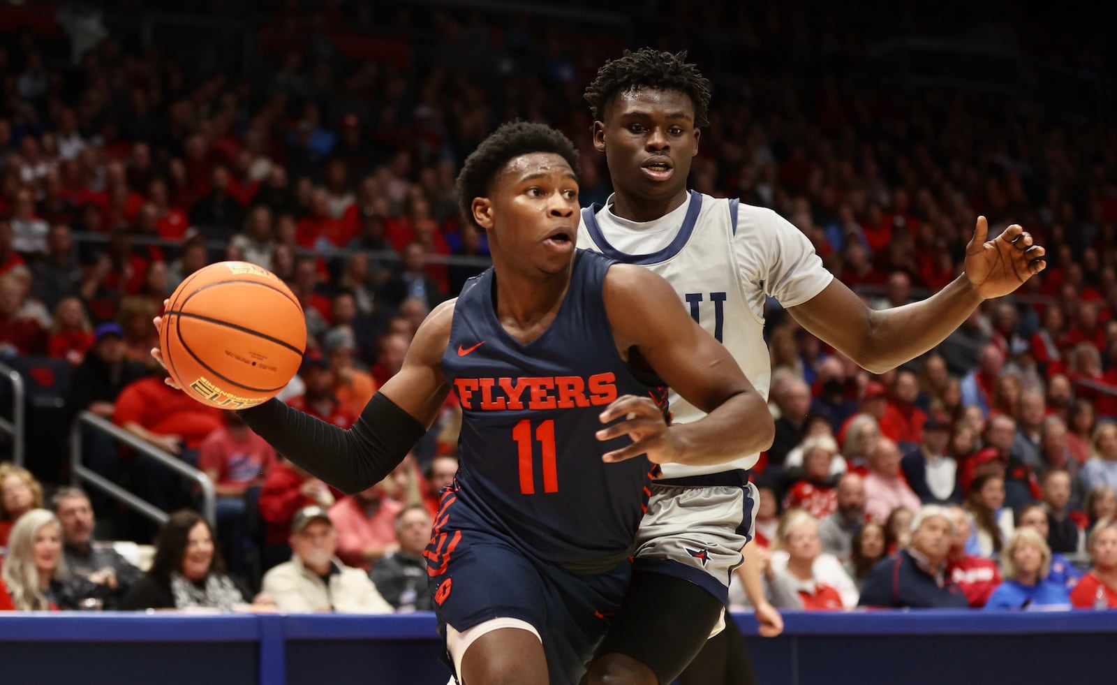 Dayton's Malachi Smith looks to make a pass against Robert Morris on Saturday, Nov. 19, 2022, at UD Arena. David Jablonski/Staff