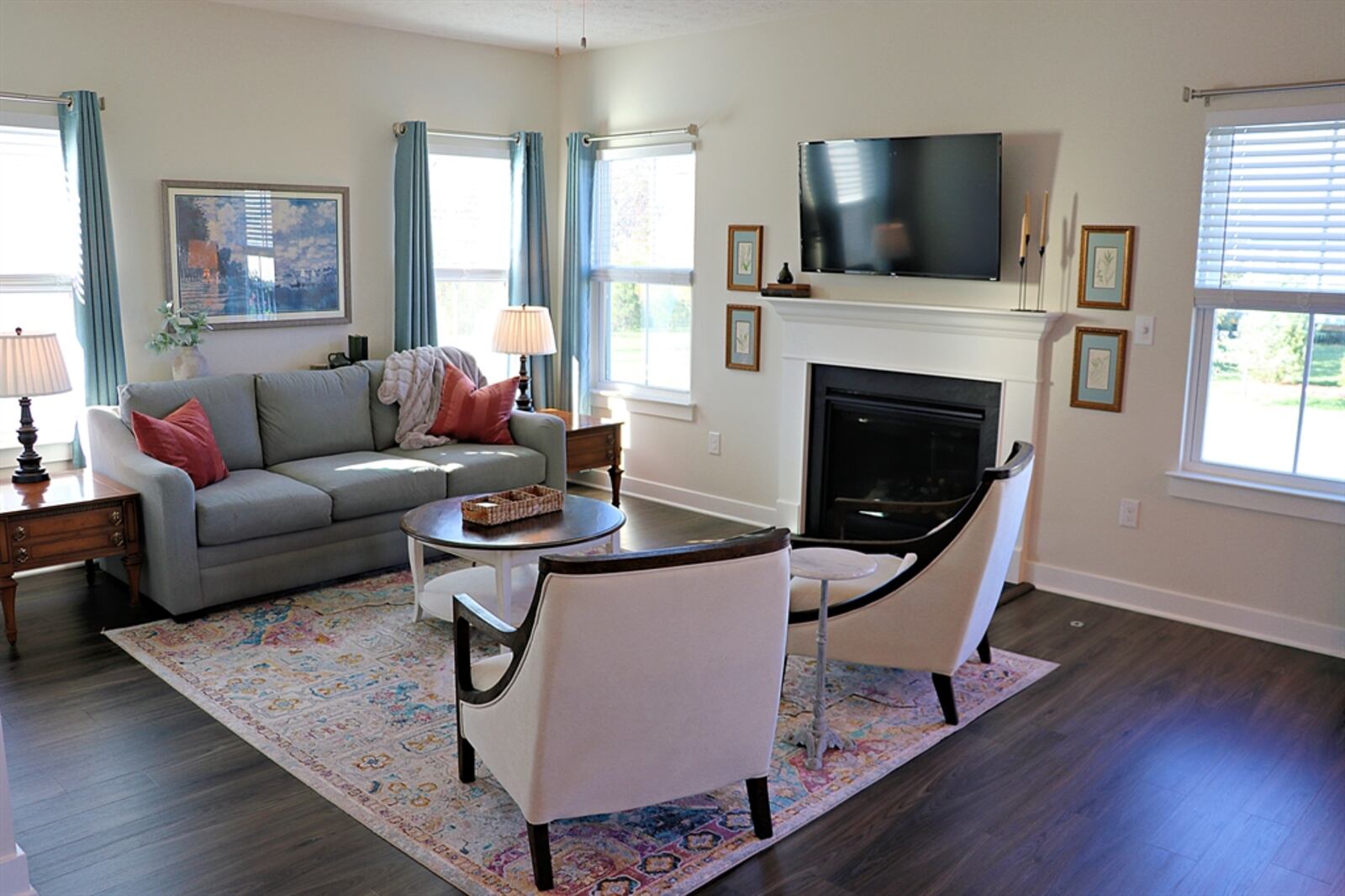 The open main-level floor plan of home features a combined great room, dining room and kitchen.