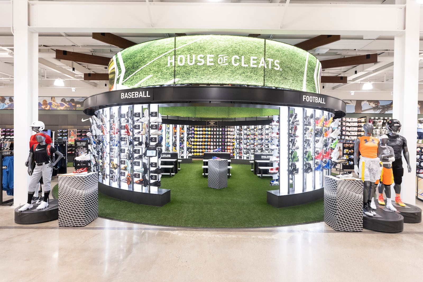 IMAGE DISTRIBUTED FOR DICK'S HOUSE OF SPORT- MINNETONKA - The House of Cleats, which sits on a turf mat allowing athletes to get an accurate feel for cleats, is a central feature at the new DICK's House of Sport in Minnetonka, Minn., which celebrated its grand opening on Friday, June 3, 2022. (Tim Gruber/AP Images for DICK'S House of Sport - Minnetonka)