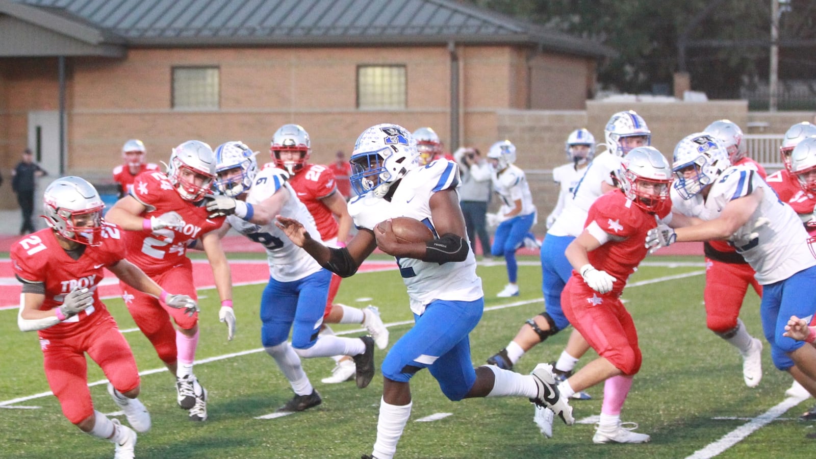 Xenia's Deaunte White runs for a touchdown as the Troy Trojans play host to Xenia Buccaneers Friday, Oct. 4, 2024 at Troy Memorial Stadium in Troy.