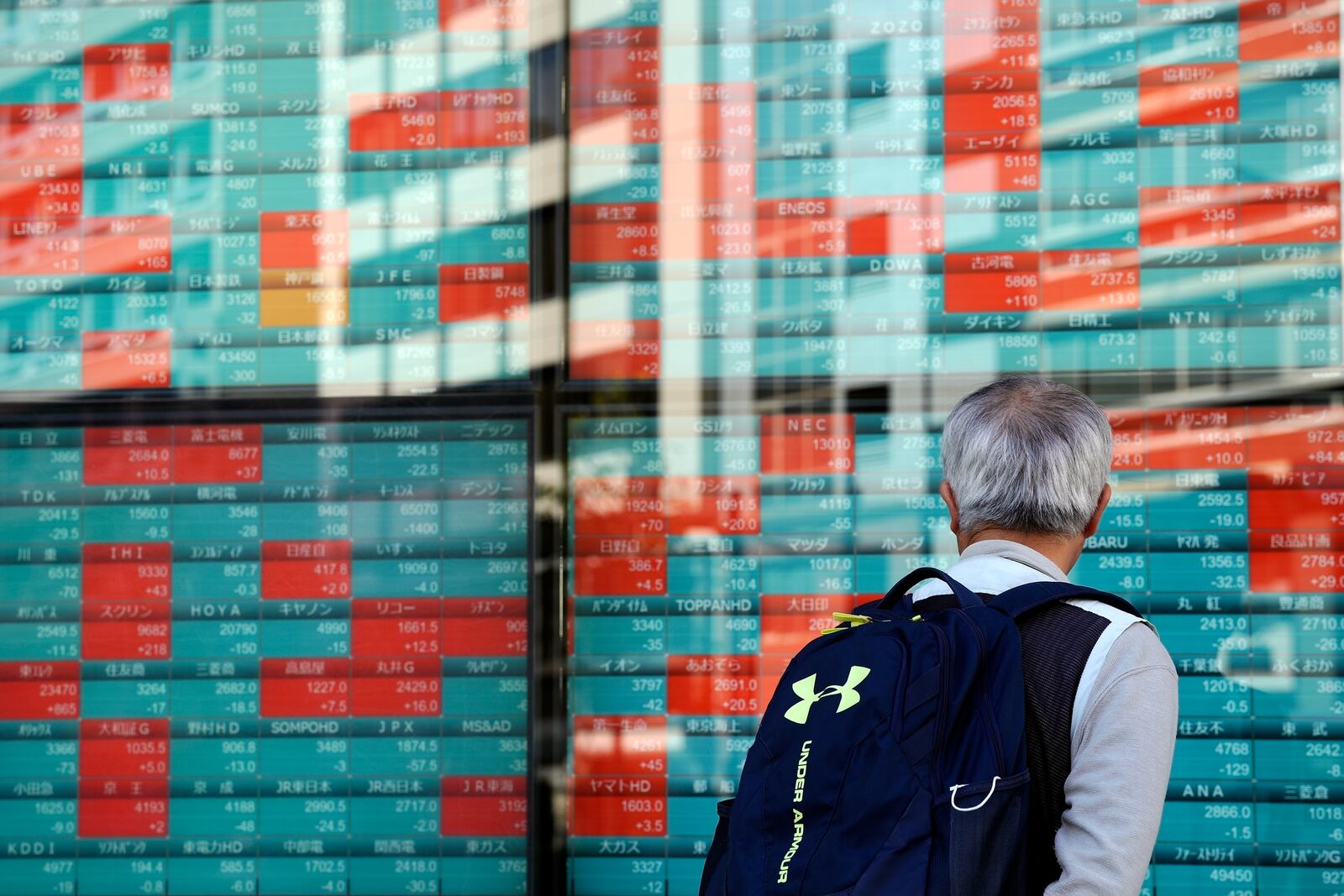 FILE - A person looks at an electronic stock board showing Japan's Nikkei index at a securities firm Wednesday, Nov. 13, 2024, in Tokyo. (AP Photo/Eugene Hoshiko, File)