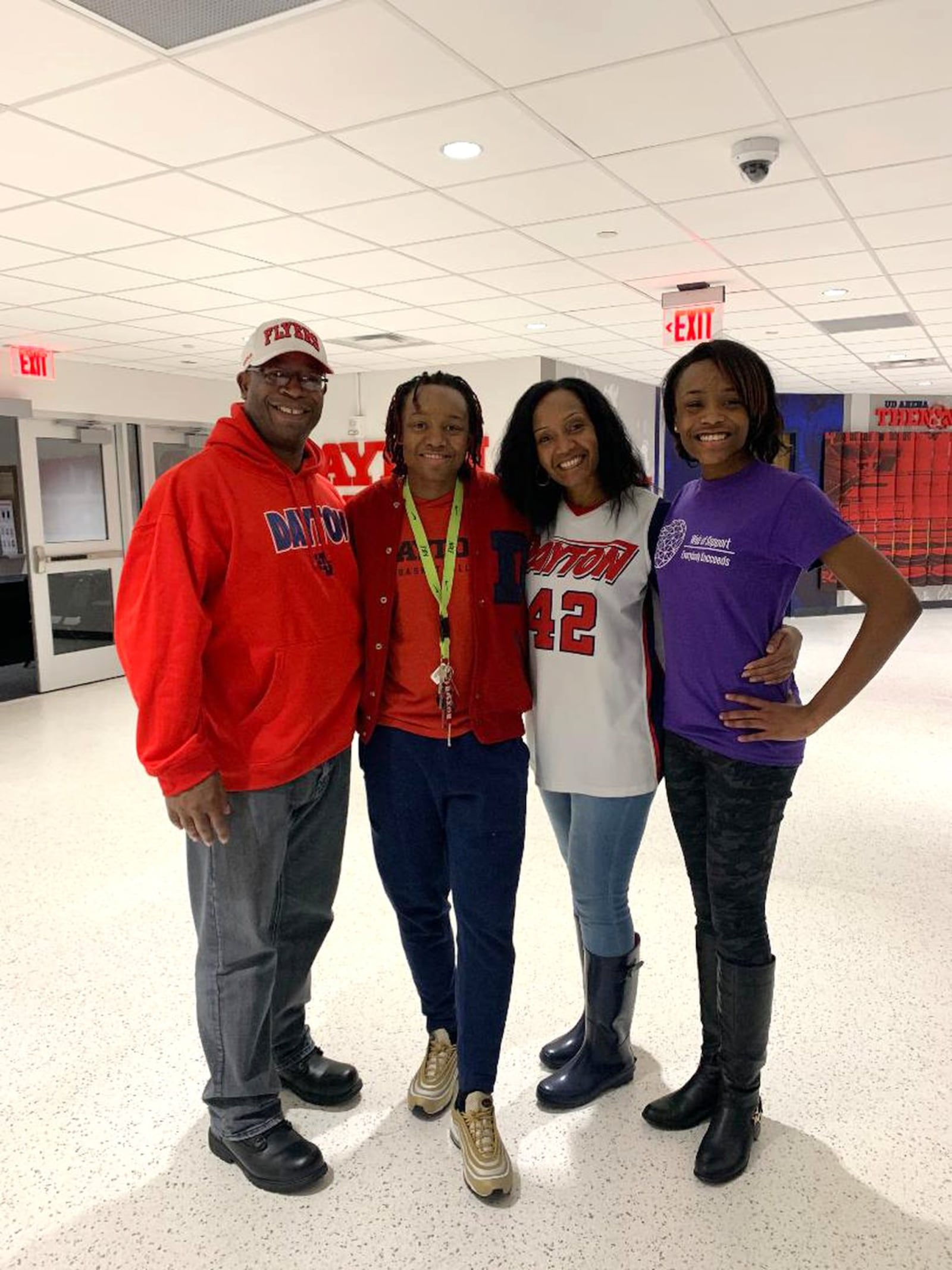 Dayton women’s basketball standout Jayla Scaife with her family after Wednesday night’s win over St. Bonaventure at UD Arena. Pictured from left: her dad Rob, Jayla, her mom Wilisha and younger sister Jasi. CONTRIBUTED