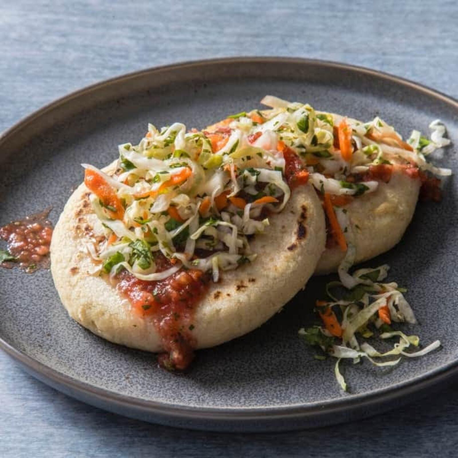 El Meson's  Salvadorian Pupusas, Grilled Flat Corn Bread Stuffed with Beans and Cheese and topped with Spicy Cabbage. CONTRIBUTED