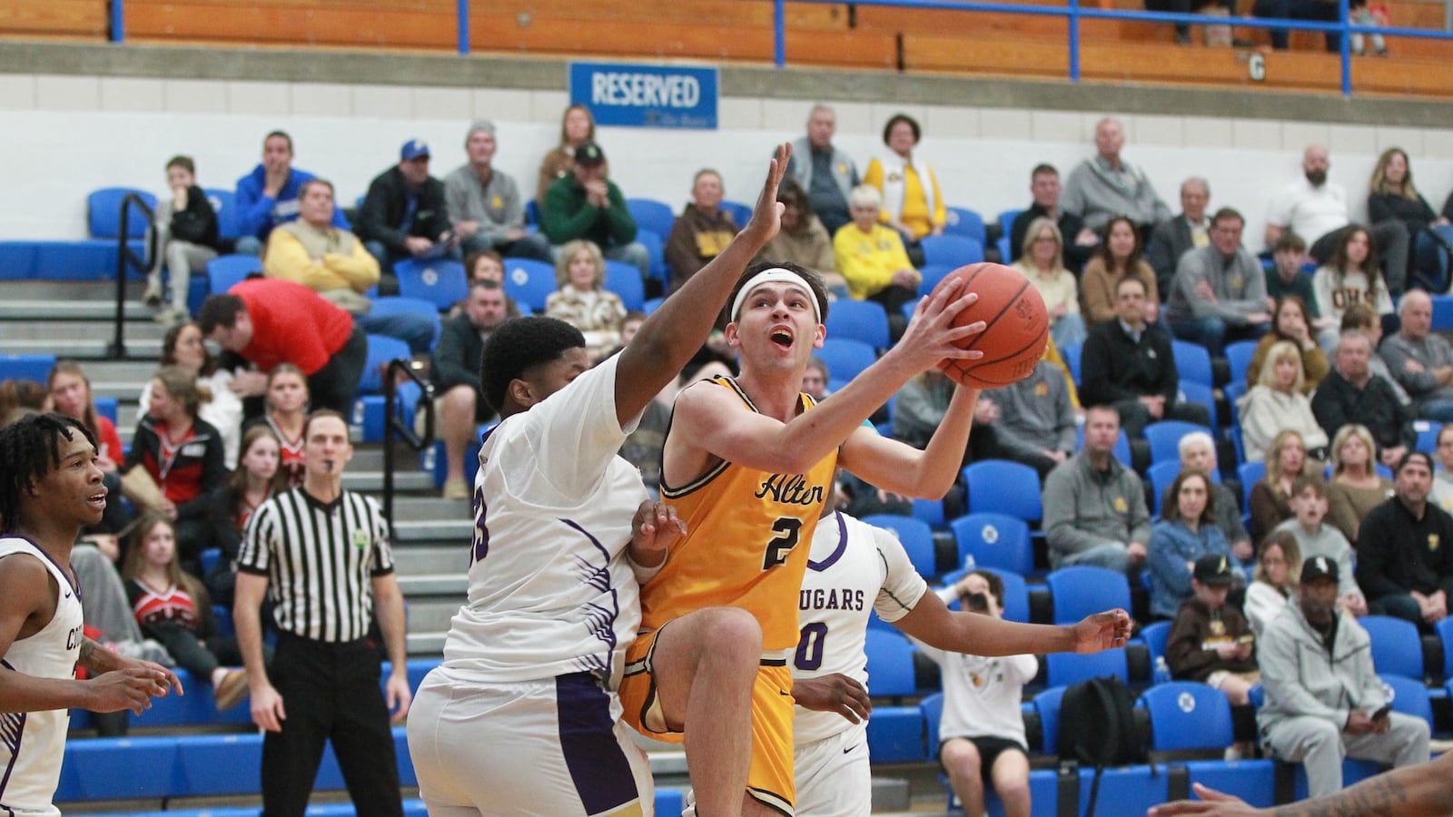 Brady Conner attempts to score for Alter against Thurgood Marshall boys basketball district semifinal in Xenia Feb. 26, 2025.