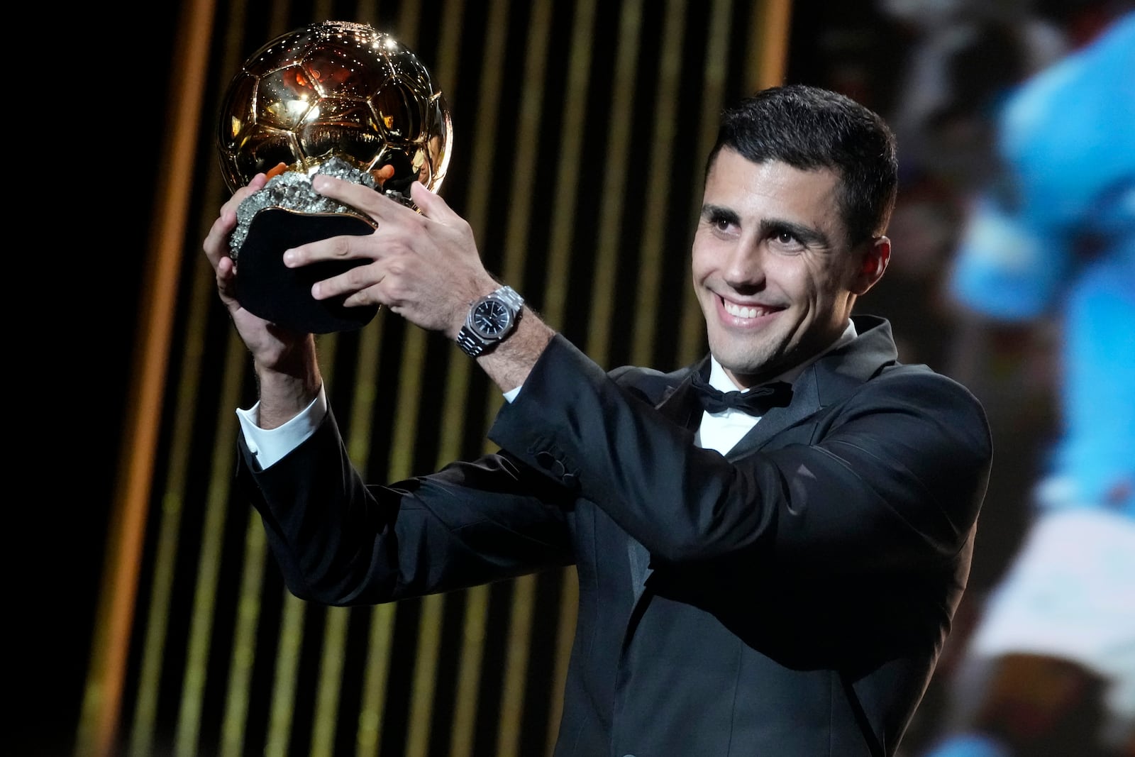 Spanish player Rodri receives the 2024 Men's Ballon d'Or award during the 68th Ballon d'Or (Golden Ball) award ceremony at Theatre du Chatelet in Paris, Monday, Oct. 28, 2024. (AP Photo/Michel Euler)