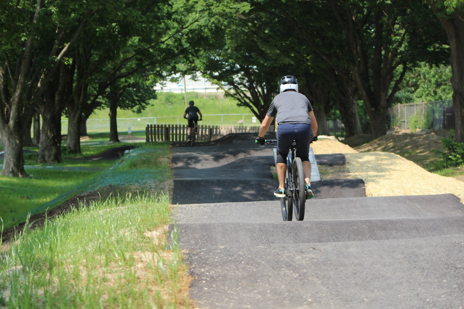 Dan McIntyre, 42, of Middletown, and Brandon Botschner, 39, of Oakwood, ride the tracks at the Dayton Bike Yard on May 18, 2023. CORNELIUS FROLIK / STAFF