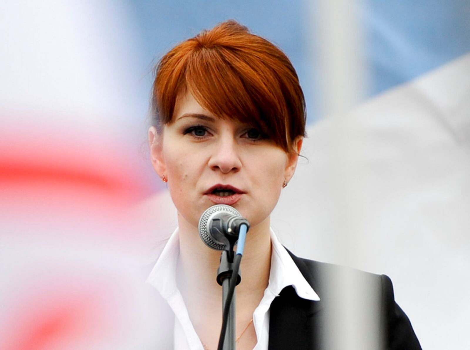 In this photo taken on Sunday, April 21, 2013, Maria Butina, leader of a pro-gun organization in Russia, speaks to a crowd during a rally in support of legalizing the possession of handguns in Moscow, Russia. Butina, a 29-year-old gun-rights activist, served as a covert Russian agent while living in Washington, gathering intelligence on American officials and political organizations and working to establish back-channel lines of communications for the Kremlin, federal prosecutors charged Monday, July 16, 2018. (AP Photo)