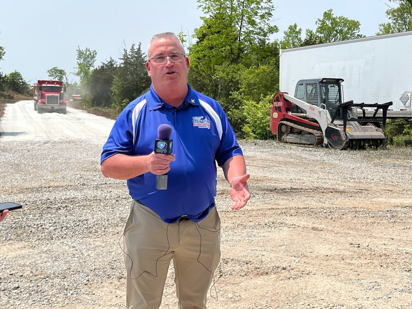 Kevin Franklin, executive director of the CenterPoint Energy Dayton Air Show, standing new where a new access road to air show general admission parking was being built Thursday. THOMAS GNAU/STAFF