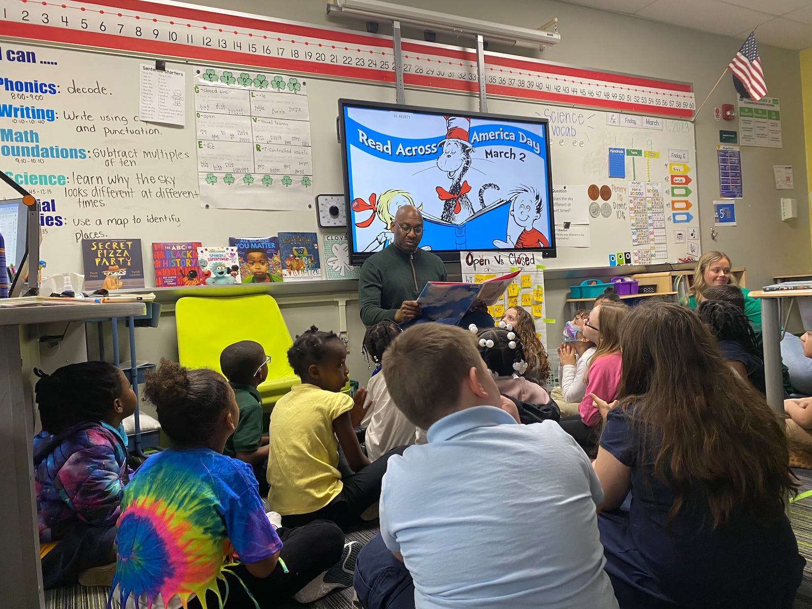 David Lawrence, Dayton Public Schools superintendent, reads to first-graders at Cleveland Elementary on Friday, March 1. Eileen McClory/ Staff