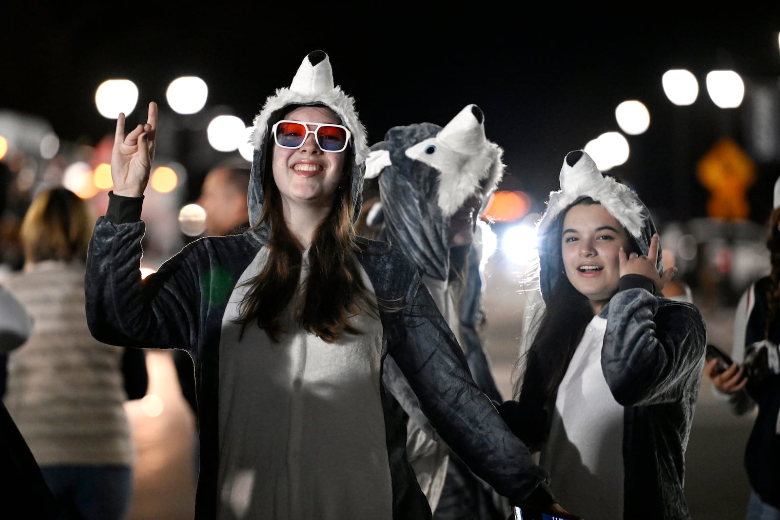 Fans pose for photos as they line up to come into Gampel Pavilion before an NCAA game between UConn and Fairleigh Dickinson, Wednesday, Nov. 20, 2024, in Storrs, Conn. (AP Photo/Jessica Hill)