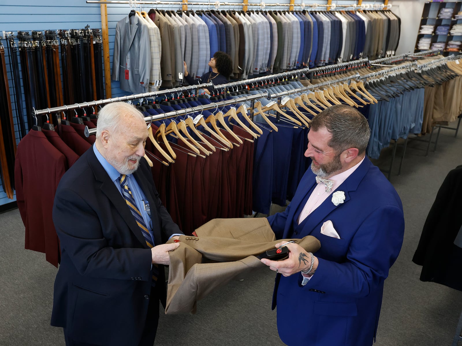 Edd Wimsatt, left, owner of Price Stores talks with store mgr. Joshua Singleton. The store is located at 553 Miamisburg Centerville Road in Centerville. MARSHALL GORBY\STAFF