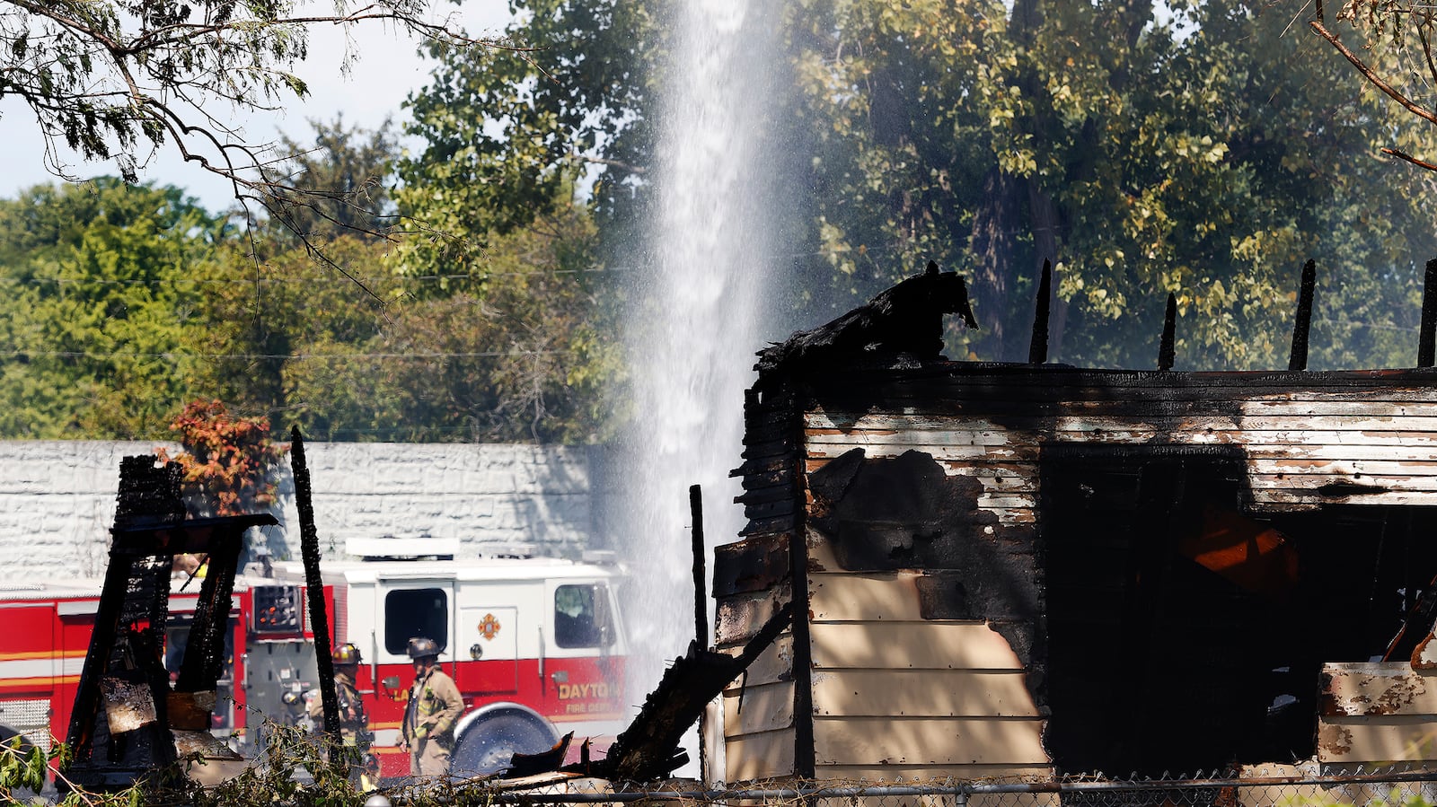 Trotwood and Dayton Fire Departments responded to a fully involved vacant house fire at 5813 Lorimer Street, Monday, Aug. 12, 2024. No injuries were reported. MARSHALL GORBY\STAFF