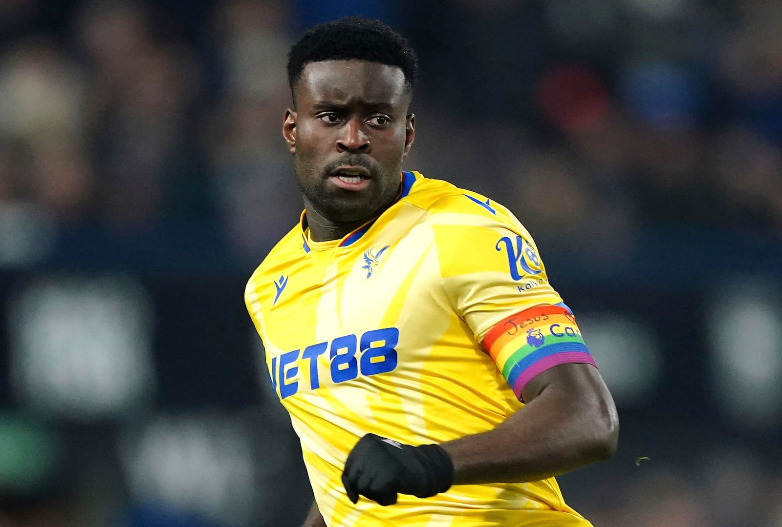 Crystal Palace's Marc Guehi wears the Rainbow Laces captain's armband which has the words 'Jesus Heart You' on during the England Premier League soccer match between Ipswich Town and Crystal Palace at Portman Road, Ipswich, England, Tuesday, Dec. 3, 2024. (Zac Goodwin/PA via AP)