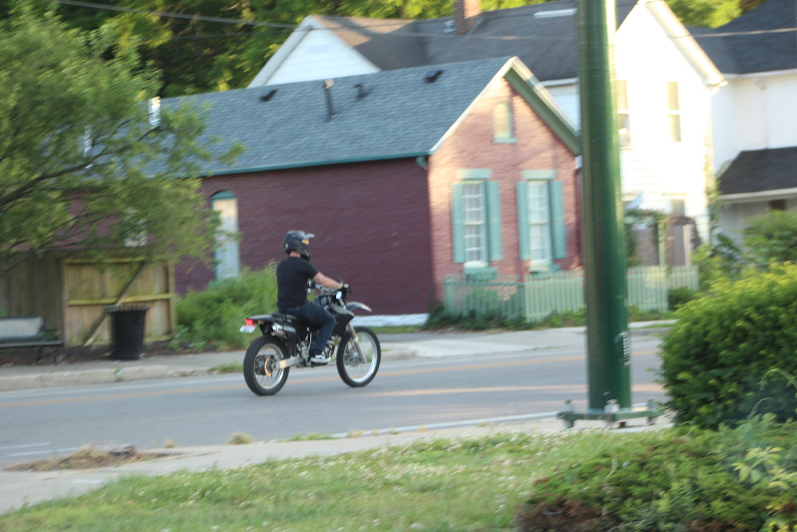 A dirt bike rides along Wyoming Street in Dayton. Some people operate vehicles on city roadways that are not permitted, like ATVs and dirt bikes that do not have the proper safety equipment, like headlights and turn signals, police said. CORNELIUS FROLIK / STAFF