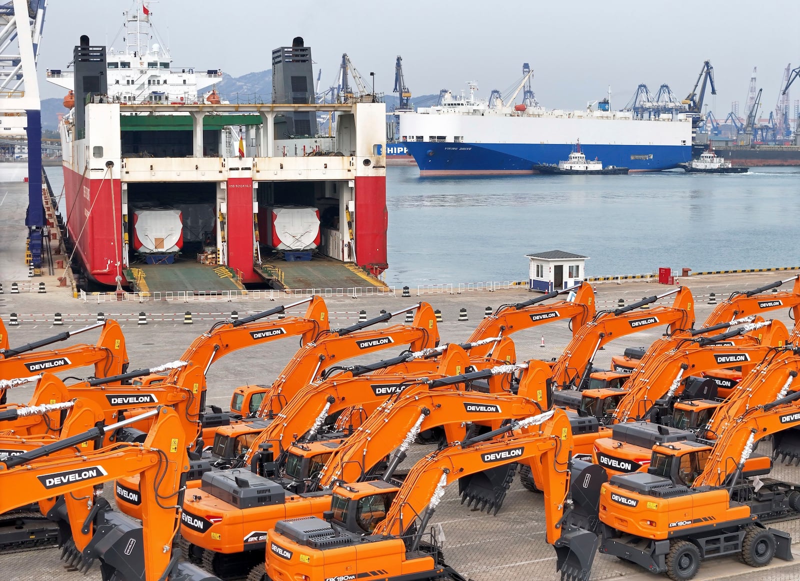 FILE - Engineering vehicles for export wait for transportation from a port in Yantai in eastern China's Shandong province, Tuesday, Nov. 19, 2024. (Chinatopix Via AP, File)