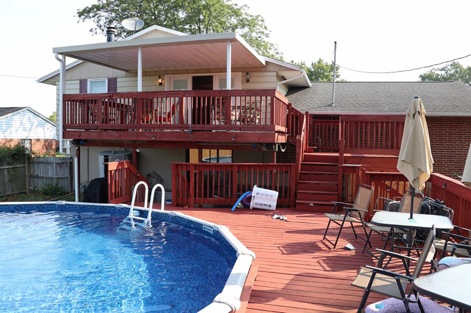 The swimming pool was installed in August and the deck was recently stained. Sections of the fence have been replaced. An awning was installed over the top level of the deck and a hot tub is tucked under the balcony deck on a large concrete patio.. CONTRIBUTED PHOTO BY KATHY TYLER