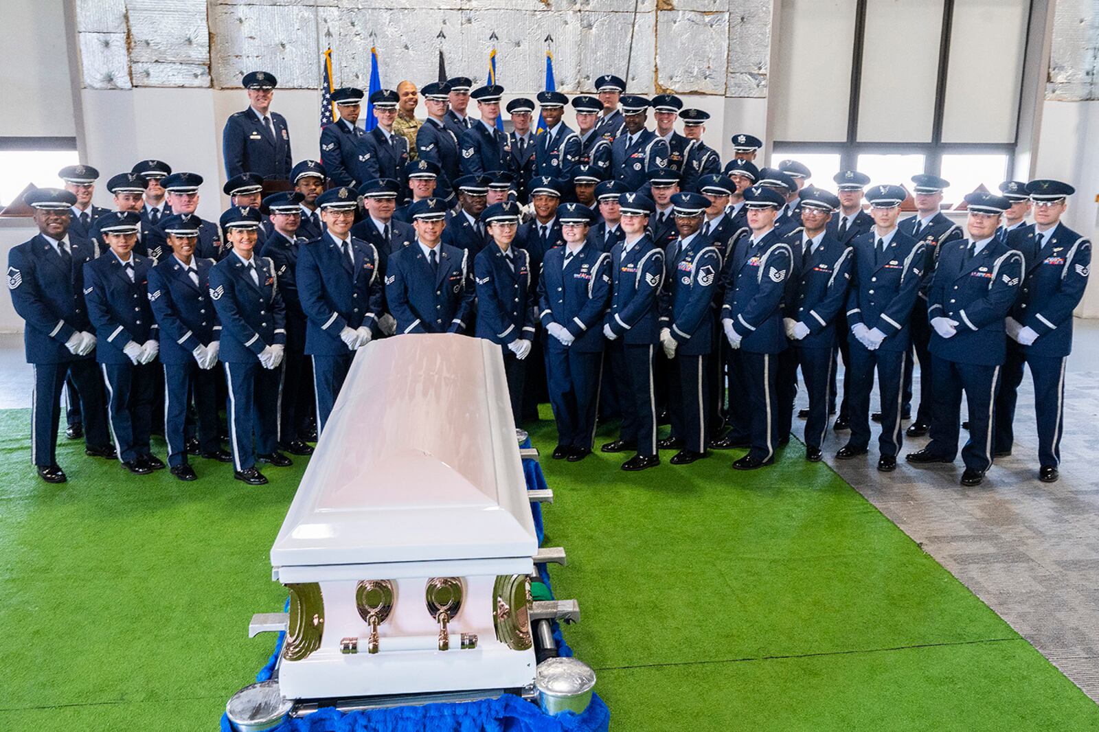 A new class of Wright-Patterson Air Force Base Honor Guard members pose with with Col. Patrick Miller, 88th Air Base Wing and installation commander (rear left), and their trainers following their graduation ceremony on April 25. U.S. AIR FORCE PHOTO/R.J. ORIEZ